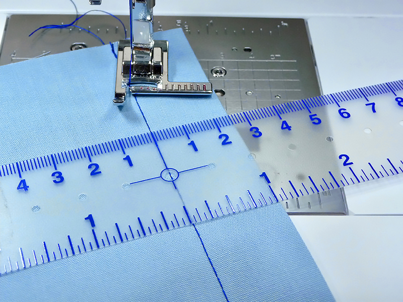 Use your ruler to align the stitch guide foot