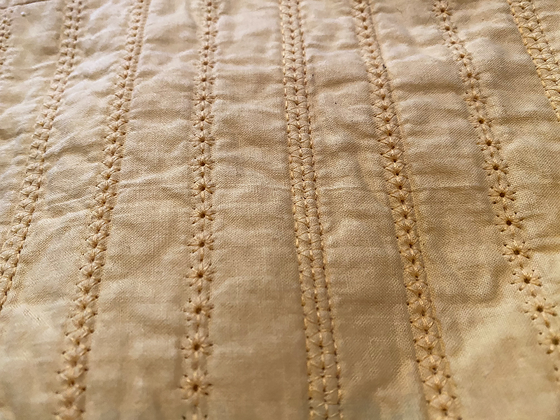 tan quilt