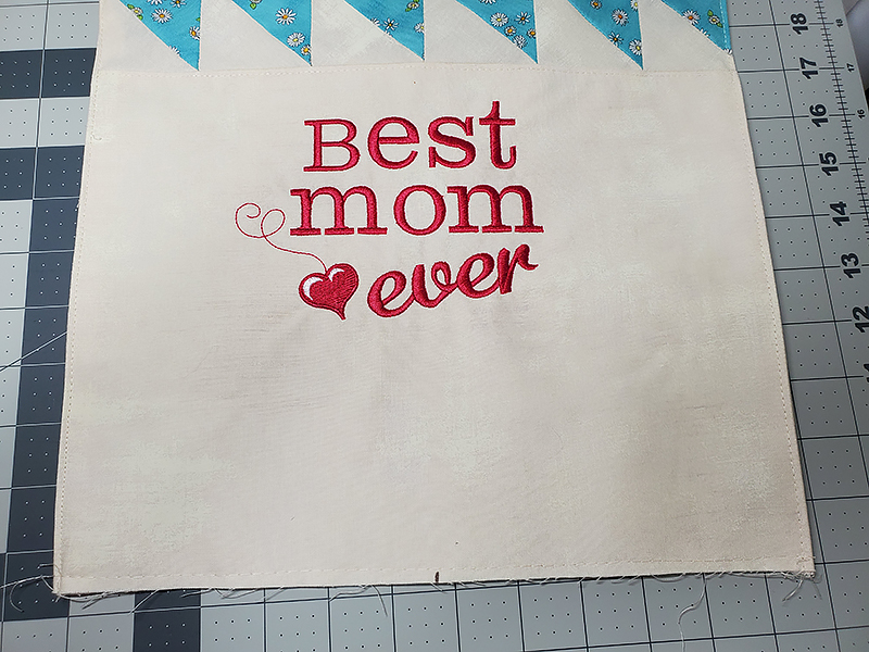 mark the bottom front center of apron bib